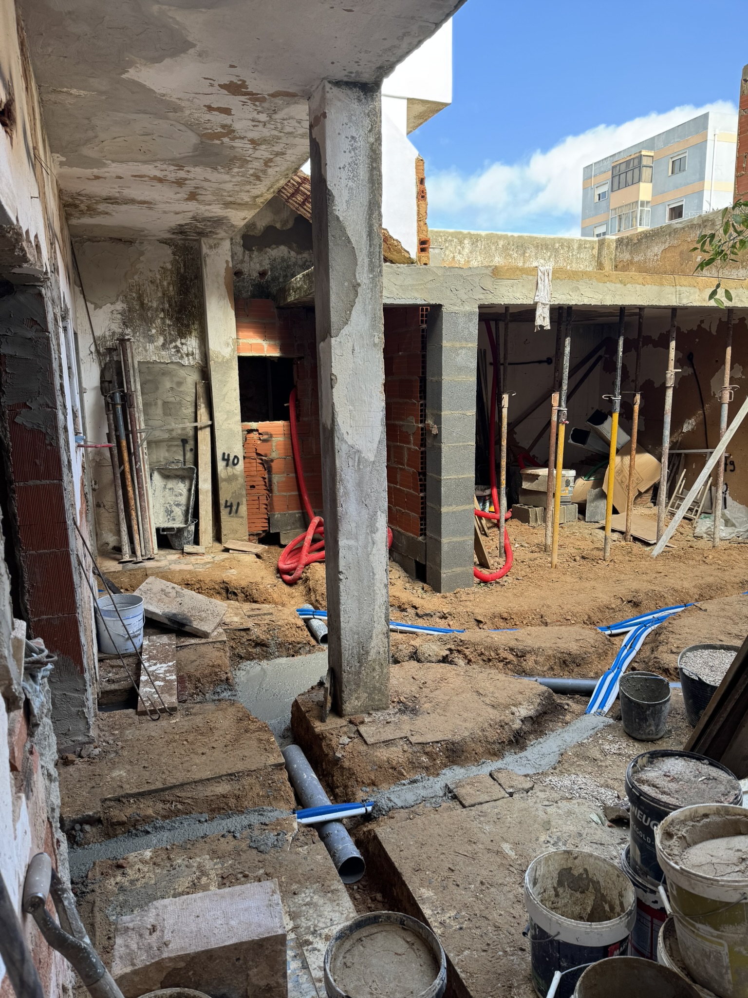 trenches for new plumbing and AC